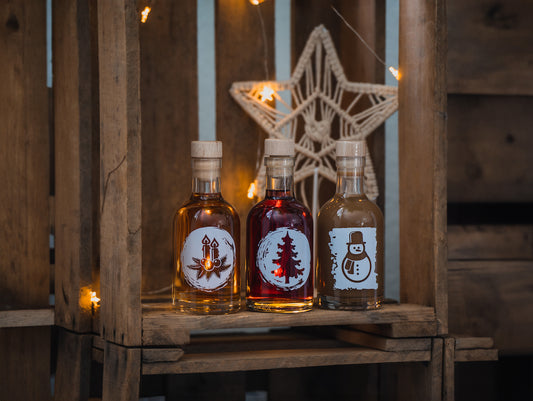 Deheck Weinachslikör als Geschenk mit Alkohol für Weihnachten 3 Sorten Bratapfel, Spekulatius und Pflaume-Zimt Likör